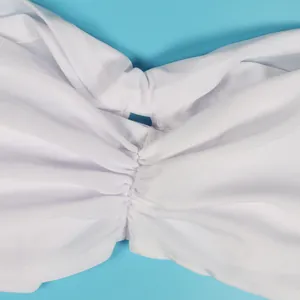 Detailed macro view of the white ruched elastic fabric texture for bandeau dress sets