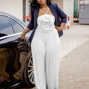 Elegant white pleated jumpsuit featuring a large 3D floral accent on the chest