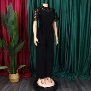Elegant black jumpsuit with lace hollow short sleeves and high waist wide leg pants.