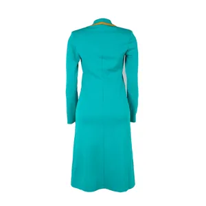 Back view of an elegant turquoise long-sleeved midi dress with yellow collar detail