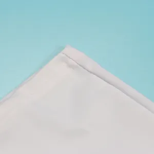 Close-up detail showing high-quality double-stitch hem on white elastic fabric garment
