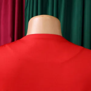 Detail view of the back neckline and textured red fabric of the African two-piece set