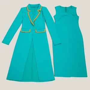 Detail view of turquoise two-piece suit with long blazer and sleeveless dress.