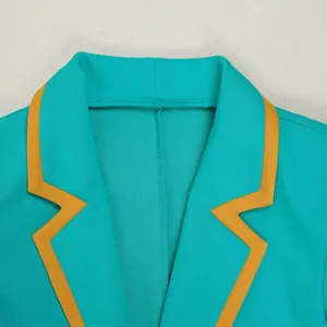 Detailed view of elegant turquoise blazer lapel with a contrasting orange trim design