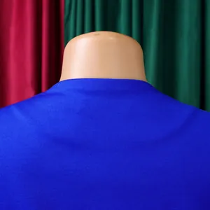 Detail shot of the back neckline and blue fabric texture of an elegant African suit