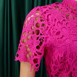 Detailed close-up view of fuchsia floral lace hollow-out sleeve texture on jumpsuit