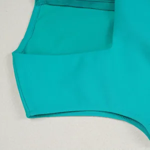Close-up of a teal elastic blazer vest showing the fine stitching and smooth fabric texture.