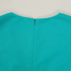Detail of turquoise elegant suit vest with high-quality back hidden zipper closure.