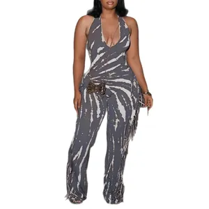 Sexy tie-dye halter neck jumpsuit featuring side fringe detail and slim fit design