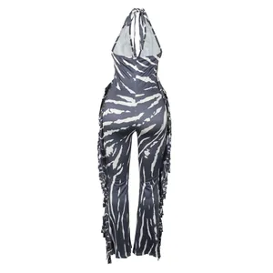 Back view detail of this elegant halter neck backless fringe print flare jumpsuit