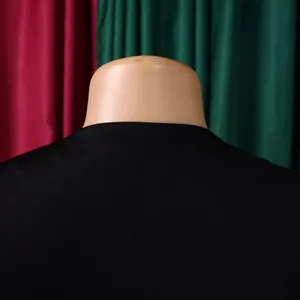 Detailed view of the sleek black neckline on a stylish African fashion two-piece suit