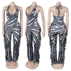 Front, side, and back views of a zebra print halter neck fringe jumpsuit on a mannequin