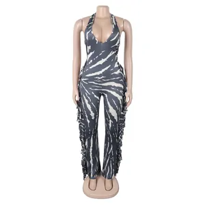 Detailed view of the halter neck zebra print jumpsuit with side fringe accents