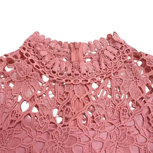 Detailed view of pink hollow-out lace high neck with scalloped edge and back zipper