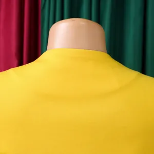 Detailed back view of yellow African style top showing neckline and knit texture.