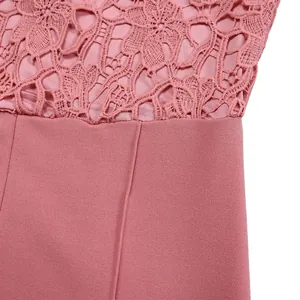 Detailed close-up showing the pink floral lace pattern and garment texture