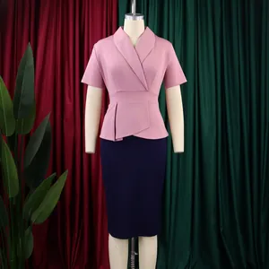 Elegant pink short-sleeved peplum top paired with navy blue pencil skirt on mannequin