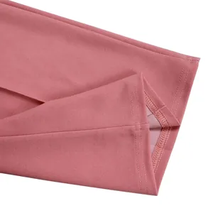 Close-up of pink jumpsuit hem showing high-quality stitching and fabric texture
