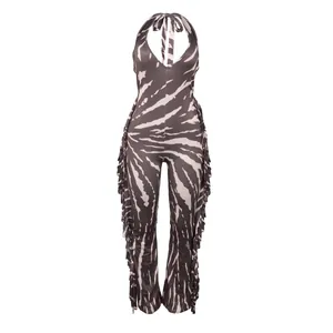 Detailed view of the halter neck jumpsuit with tie-dye print and side fringe