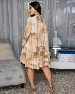 Detailed back view of an elegant loose floral patchwork short dress in warm earth tones