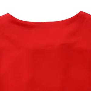 Close-up of vibrant red fabric texture on elegant women's African two-piece fashion set.