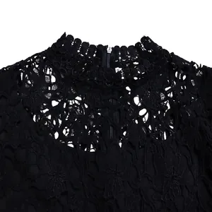 Close-up detail showing the intricate black hollow lace neckline with a discrete back zipper
