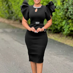 Elegant black bodycon dress featuring dramatic ruffle sleeves and diamante details.
