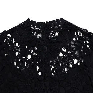Close-up detail of black hollow-out lace jumpsuit with scalloped high neck collar
