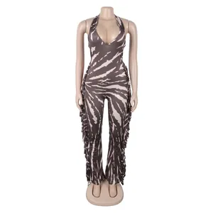 Elegant halter neck jumpsuit with zebra print and fringe details on the flared legs