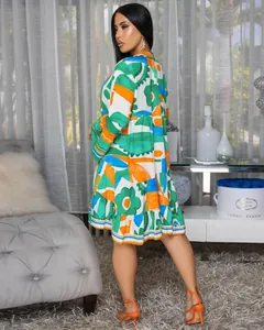 Back view of elegant loose short dress featuring vibrant floral patchwork print.