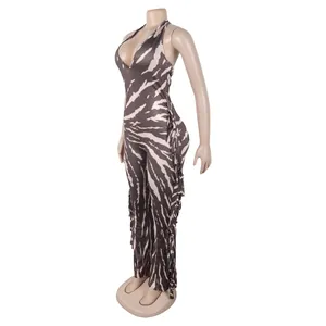 Side view of sexy zebra print halter jumpsuit featuring long fringes and flared legs
