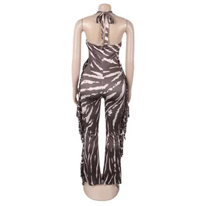 Elegant tiger print backless halter jumpsuit featuring side fringe and flared leg design