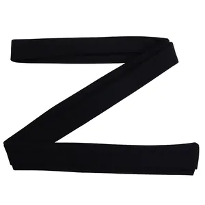 Detailed macro view of the long black fabric waist tie accessory for women's jumpsuit