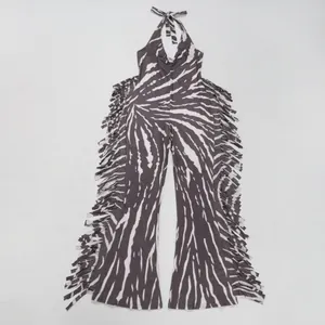 Flat lay view of a zebra print halter jumpsuit showing the intricate side fringe detail