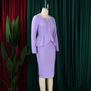 Elegant purple long sleeve dress with peplum waist detail shown on a mannequin side view