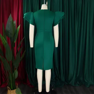 Detailed back view of emerald green bodycon dress with elegant ruffle lotus sleeves