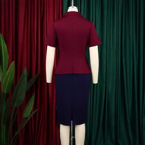 Back view of an elegant color-block peplum pencil dress in burgundy and navy blue.