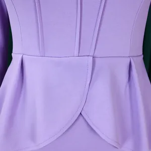 Detailed close-up showing the elegant purple peplum waist design on this long-sleeved dress