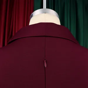 Close-up of back neckline and concealed zipper on an elegant burgundy bodycon dress.