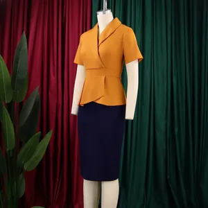 Close-up detail of an elegant plus size peplum dress in yellow and navy blue tones