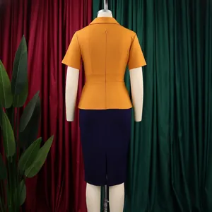 Rear view detail showing the yellow top and navy blue skirt of this color-block dress