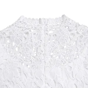 Close-up of elegant white floral lace pattern and high neckline on a jumpsuit