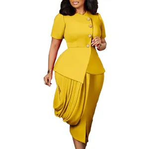 Detailed view of yellow two-piece set featuring asymmetrical top and draped skirt