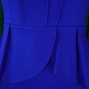 Macro view of the royal blue ruffled peplum detail on an elegant African style dress.