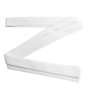Detailed view of the solid white fabric sash belt accessory for a women's jumpsuit