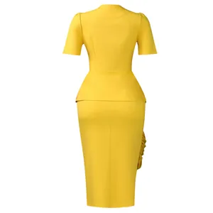 Detailed back view of an elegant yellow two-piece outfit featuring a peplum top and pencil skirt