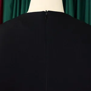 Close-up detail of the high-quality invisible back zipper on a black African dress.