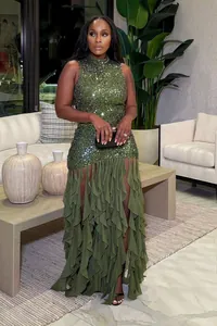 Detailed view of elegant olive green sequin dress with tiered ruffle mesh patchwork