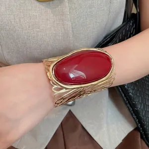 Statement vintage red oval stone cuff bracelet with gold hollow metal design for women