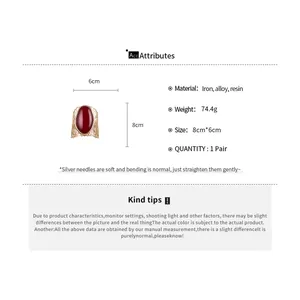 Detailed view of vintage hollow oval armlet with red resin and measurement specifications.